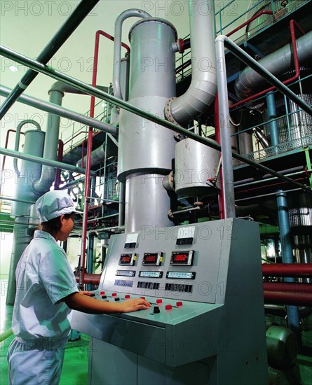 A woman is working at an industrial factory in China