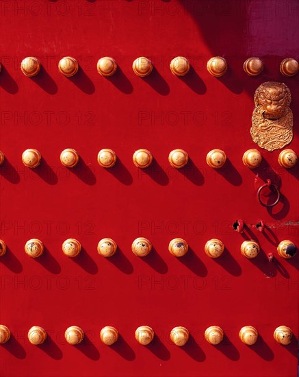 The knob on the red painted gate of the Forbidden City,Beijing,China