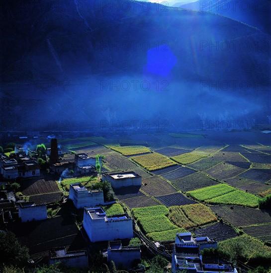 the field and cottages in Derong County,Sichuan Province,China