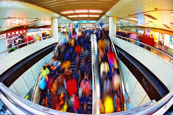 EPCrowded peopel stand the escalator of subway station of Shanghai,China