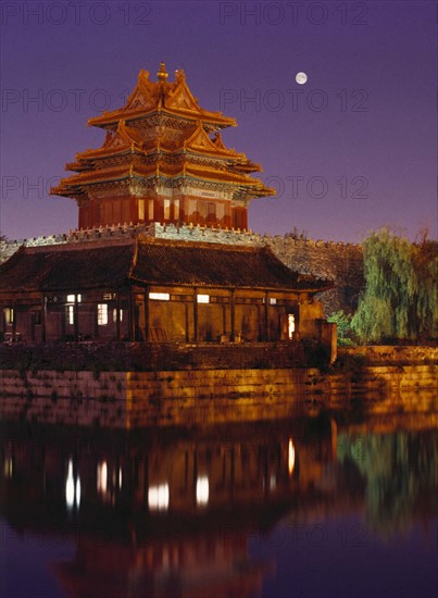 moonlight shines over a corner tower of Forbidden City,Beijing,China