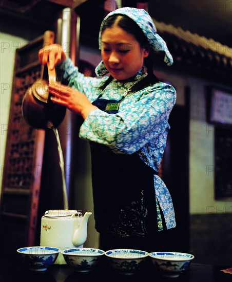 A Chinese woman shows tea art, China