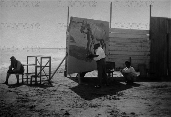 Sorolla peignant un tableau à la plage