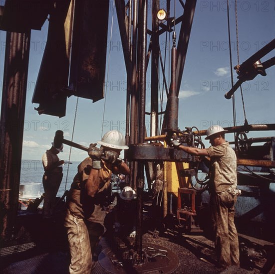 Workers on an offshore oil rig