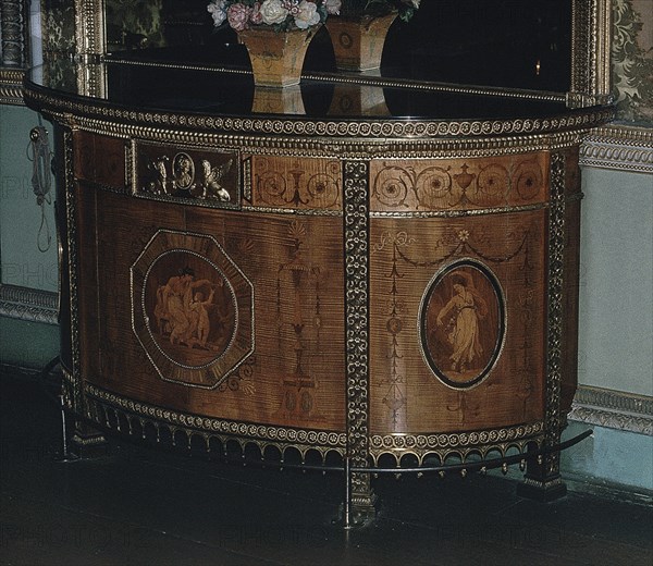 ADAM ROBERT 1728/92
INTERIOR-CONSOLA DE CILINDRO DE ESTILO GEORGIANO- MARQUETERIA Y APLIQUES EN BRONCE DORADO
LONDRES, OSTELEY PARK/ COUNTRY
INGLATERRA

This image is not downloadable. Contact us for the high res.