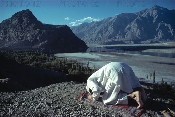 A Muslim offers prayers in the remote mountain region of Baltistan in NW Pakistan