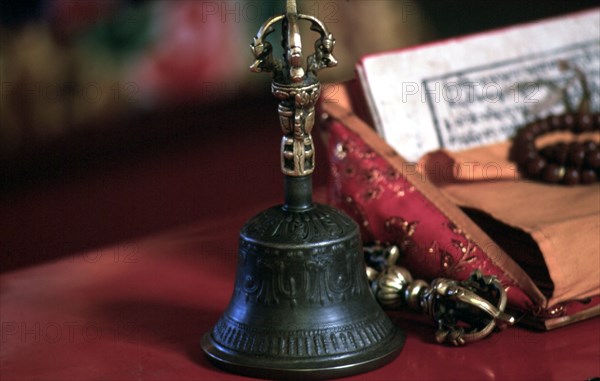 Detail in main hall (Prayer) of ritual implements and text of Tibetan buddhism (Feb. 98), Boudanath, Nepal