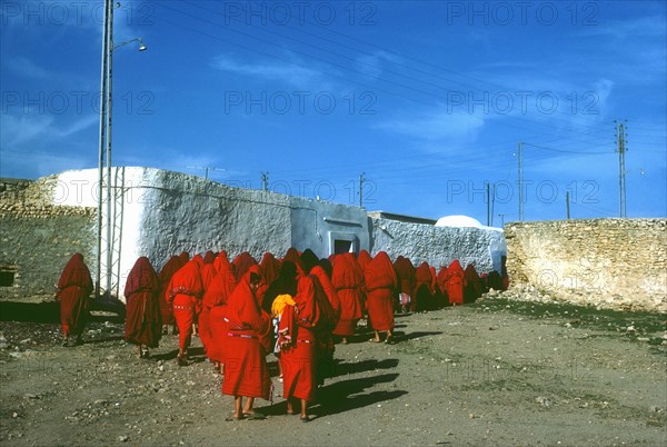 Women following a funeral bier