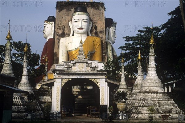 Four giant seated Buddhas in the town of Pegu Myanmar