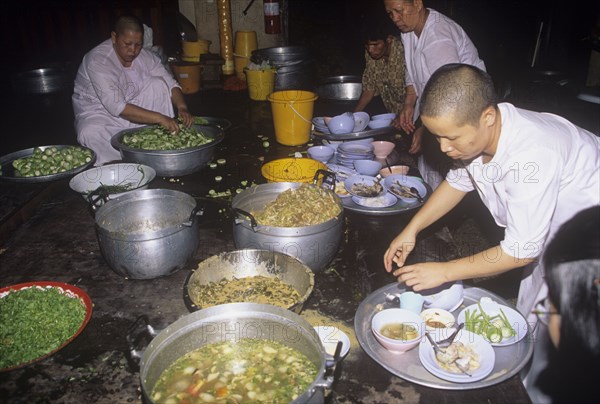 Buddhist nuns prepare lunch in a monastery in Thailand