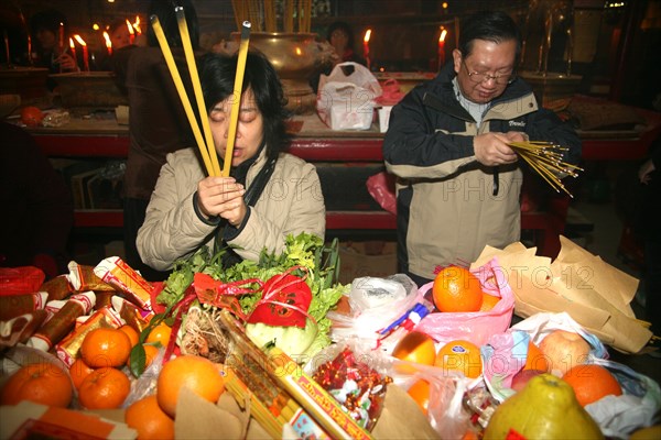 Chinese worship in a temple for new year in Hong Kong