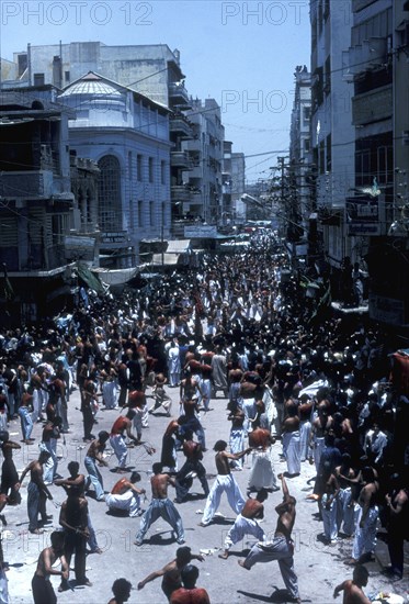 Shi`ite Muslims flagellate themselves during procession on the 10th day of Muharram Karachi