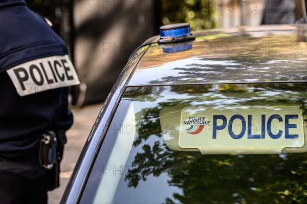 Policeman and vehicle of the French national Police