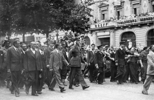 General de Gaulle walking down the Champs-Elysées, during the Liberation of Paris (August 1944)