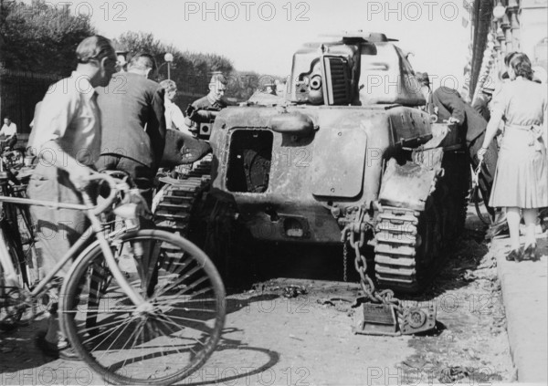 An armoured vehicule destroyed,  in the streets of Paris, during the Liberation (August 1944)