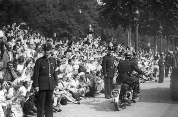 Scene of cheering crowd on the Champs-Elysées, Paris, during the Liberation (August 1944)
