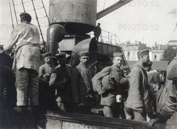 German prisoners walking down the fake bridge of the Montreal, 1914