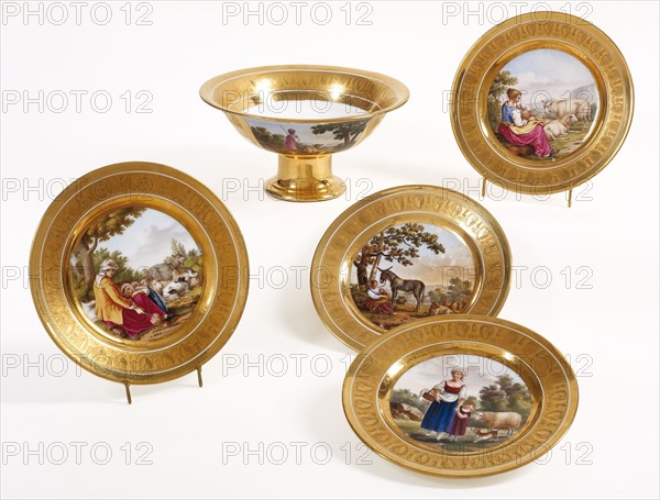 Attributed to the manufacture des frères Darte, Four plates and a cup depicting rural scenes