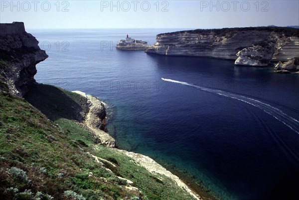 Channel of Bonifacio harbor; in the background, La Madonette lighthouse