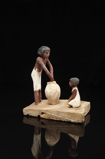 Egyptian model of a woman and a seated child