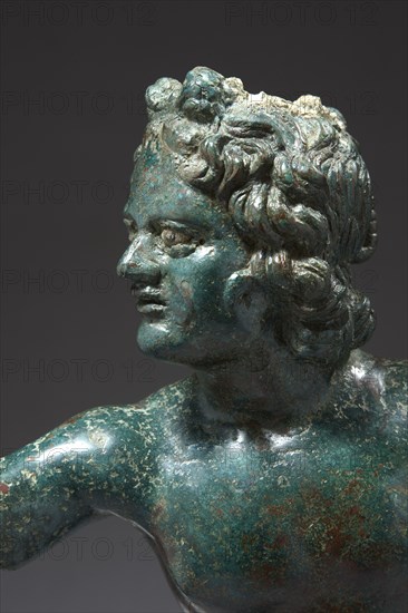 Roman statue figuring Eros Lampidarius (détail)