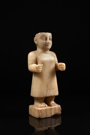 South Arabian statuette of a man inscribed with the name of Abhamid from the clan of Uhayrum