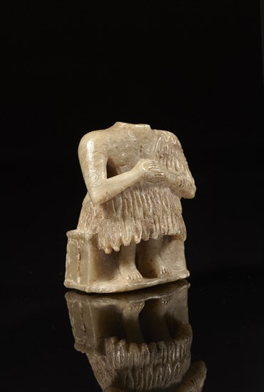 Mesopotamian votive statuette of a seated man