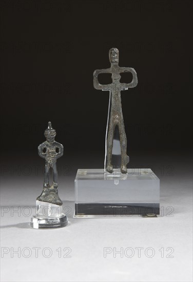 Two caucasian votive statuettes figuring stylized men