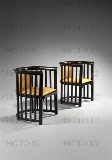 Pair of armchairs with wraparound backrest