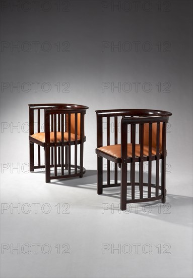 Pair of armchairs with wraparound backrest