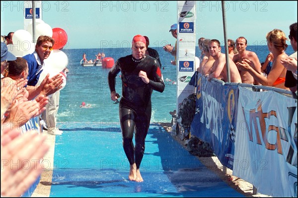 06/17/2001. Prince Albert of Monaco takes part in the first "All Stars Triathlon" in Monaco