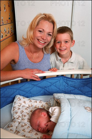 09/00/2001. Close up Muriel Hermine former Synchronized Swimming champion introduces her new born baby Killian