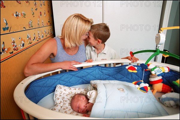 09/00/2001. Close up Muriel Hermine former Synchronized Swimming champion introduces her new born baby Killian