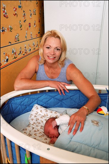 09/00/2001. Close up Muriel Hermine former Synchronized Swimming champion introduces her new born baby Killian