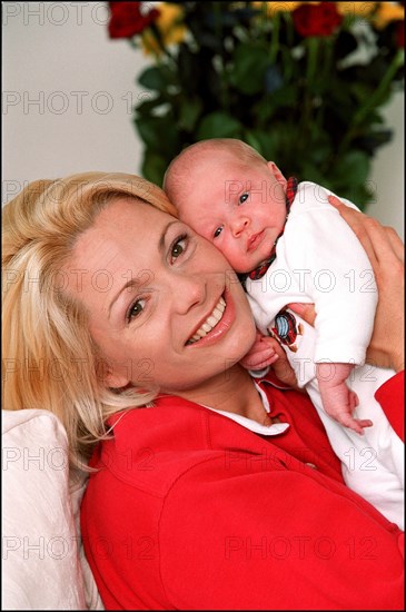 09/00/2001. Close up Muriel Hermine former Synchronized Swimming champion introduces her new born baby Killian