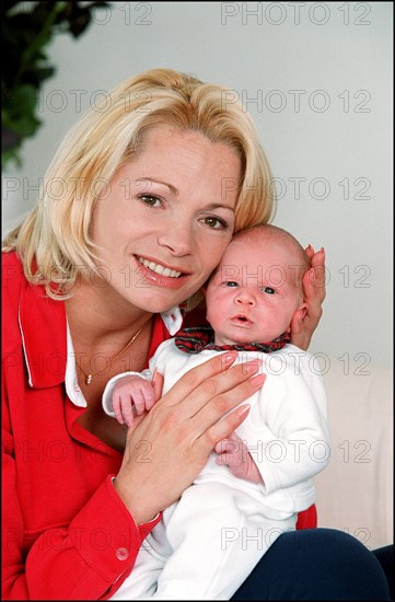 09/00/2001. Close up Muriel Hermine former Synchronized Swimming champion introduces her new born baby Killian