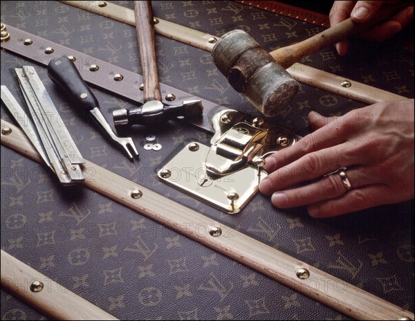 00/00/2001.  Close-up on luxury luggage Patrick Louis Vuitton in his workshop.