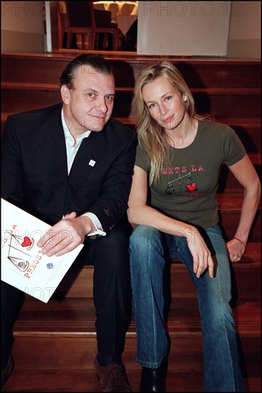 12/20/2001. Model Estelle Lefebure supports "Pour un monde plus juste, mets la pression" (for a fairer world, apply pressure) campaign.