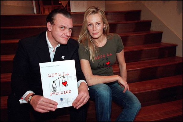 12/20/2001. Model Estelle Lefebure supports "Pour un monde plus juste, mets la pression" (for a fairer world, apply pressure) campaign.