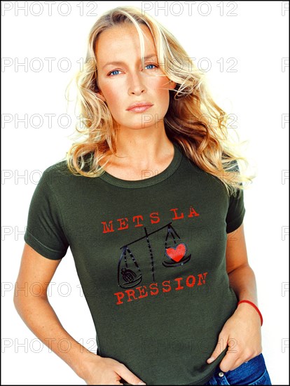 12/20/2001. Model Estelle Lefebure supports "Pour un monde plus juste, mets la pression" (for a fairer world, apply pressure) campaign.