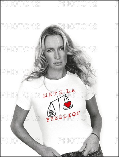 12/20/2001. Model Estelle Lefebure supports "Pour un monde plus juste, mets la pression" (for a fairer world, apply pressure) campaign.