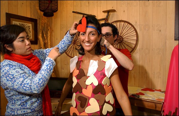 10/28/2002.  Fashion designers dress Severine Ferrer, Laure de Lattre and Mya Frye in chocolate for catwalk appearance at the 8th Salon du Chocolat, Oct. 30.