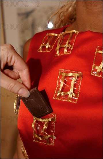 10/28/2002.  Fashion designers dress Severine Ferrer, Laure de Lattre and Mya Frye in chocolate for catwalk appearance at the 8th Salon du Chocolat, Oct. 30.