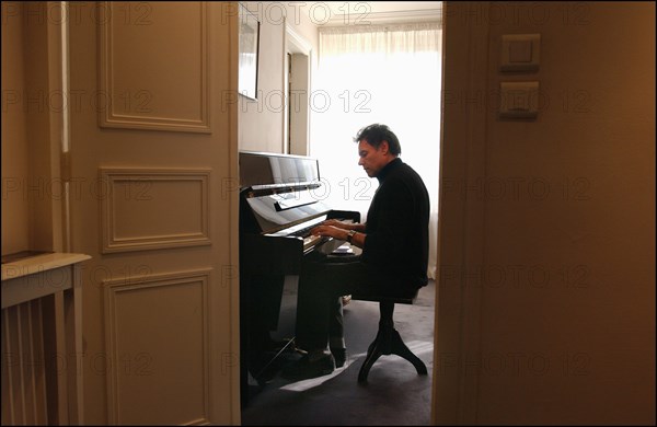 03/00/2003. Yves Simon, at home.