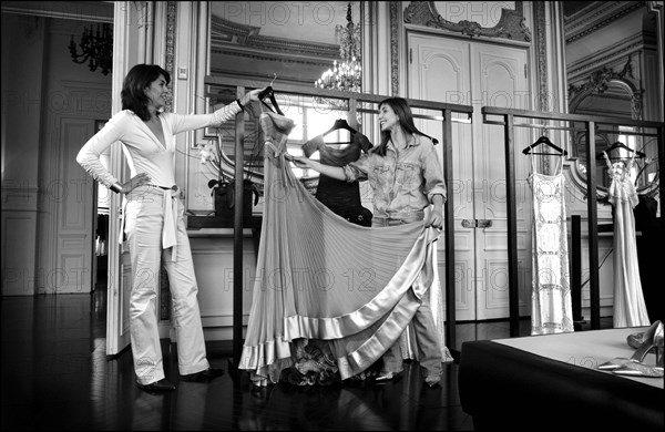 05/00/2003. EXCLUSIVE Clotilde Courau tries gowns on at Valentino's before the 56th Cannes Film