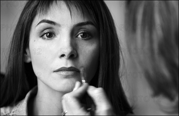 05/00/2003. Clotilde Courau tries gowns on at Valentino's before the 56th Cannes Film