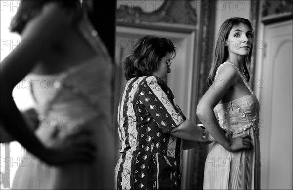 05/00/2003. EXCLUSIVE Clotilde Courau tries gowns on at Valentino's before the 56th Cannes Film