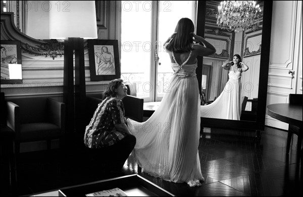 05/00/2003. EXCLUSIVE Clotilde Courau tries gowns on at Valentino's before the 56th Cannes Film