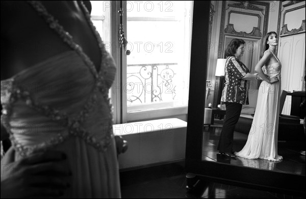 05/00/2003. EXCLUSIVE Clotilde Courau tries gowns on at Valentino's before the 56th Cannes Film