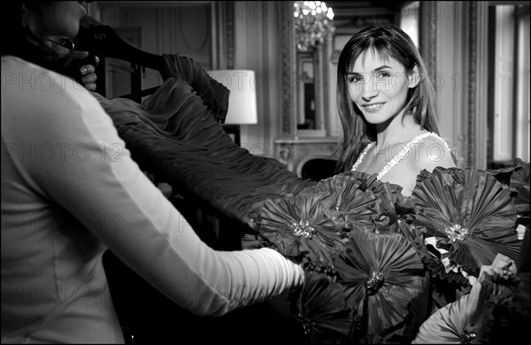 05/00/2003. Clotilde Courau tries gowns on at Valentino's before the 56th Cannes Film